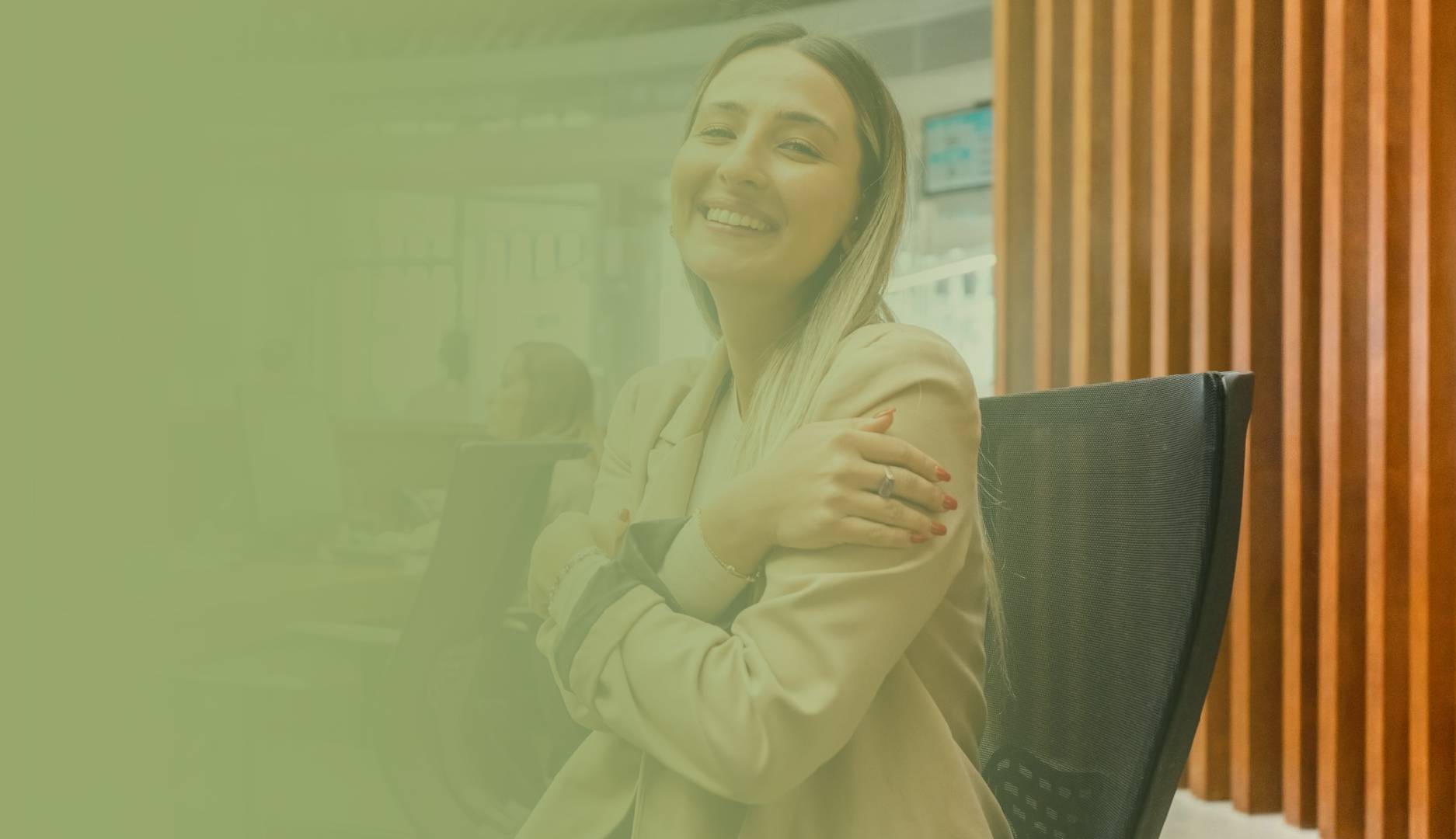 Smiling woman with arms crossed confidently